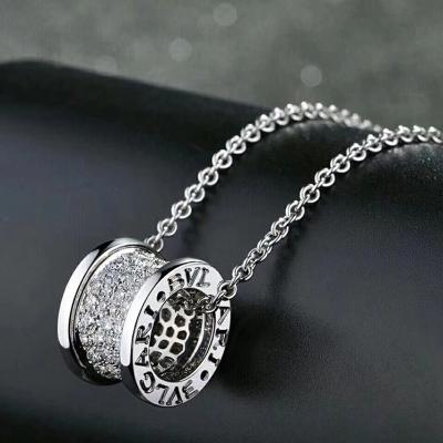 B.zero1 18 kt yellow gold pendant necklace with chain and pavé diamonds set on the spiral