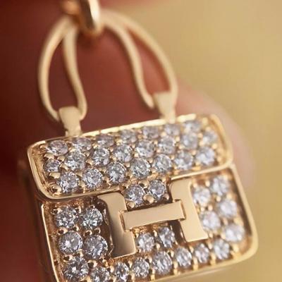 Hermès Constance Amulette Kelly Snap Closure Rose Gold Pendantt H110079B-00